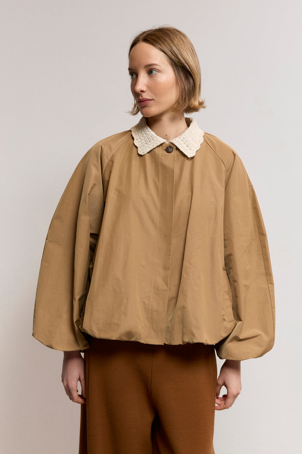Woven trench with textured knit neck