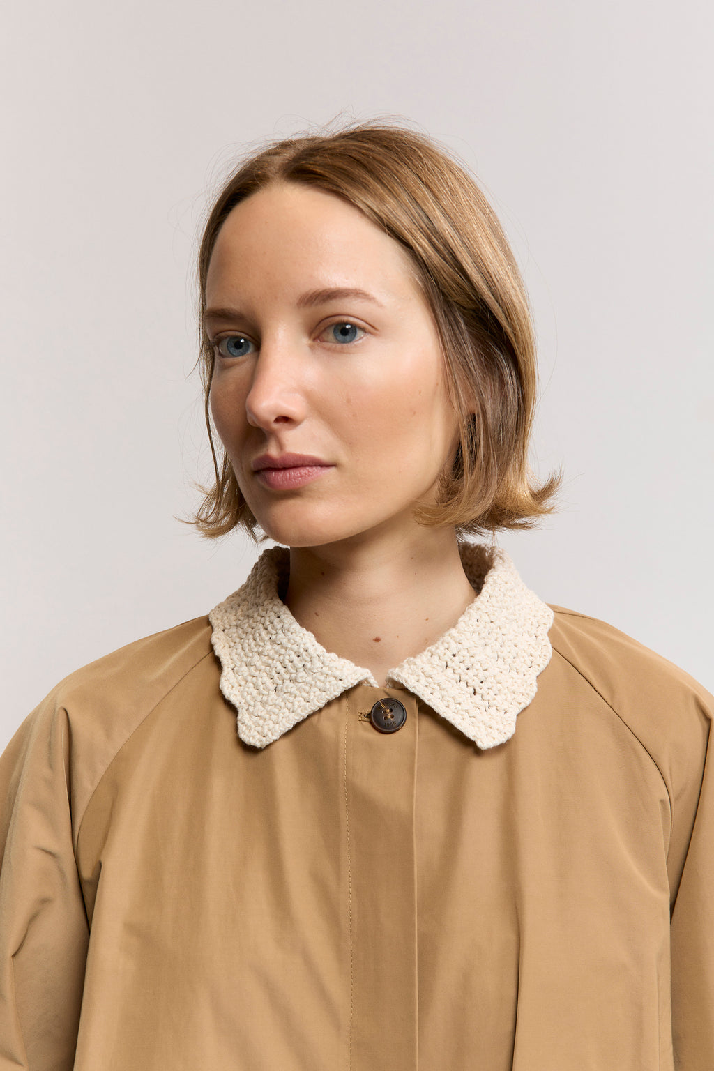 Woven trench with textured knit neck